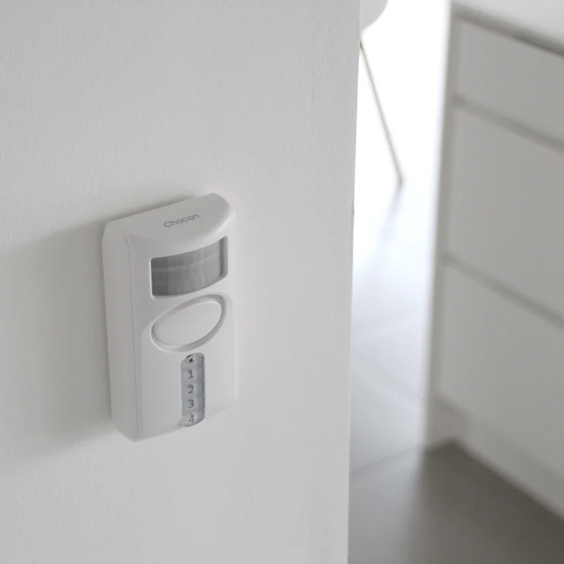 Motion detector with integrated alarm and keypad